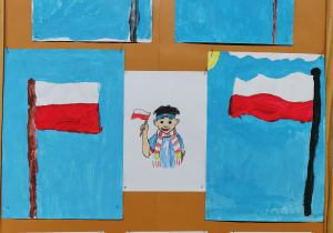 Świetlicowa gazetka z okazji Narodowego Święta Niepodległości - flagi Polski i postacie trzymające flagi